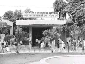 Patients and visitors milling around the Accident and Emergency Services wing at the Pt B. D. Sharma Postgraduate Institute of Medical Sciences, Rohtak 