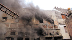 Firefighters trying to douse the flames at Bhagirath Place at Chandni Chowk in the Capital