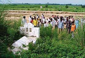 Villagers at the disputed land in Birmi village, Ludhiana, on Saturday.