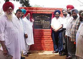MLA and PPCC general secretary Malkiat Singh Dakha at the launch of a Rs 60-lakh sewerage project at Thakarwal village, near Ludhiana, on Saturday.