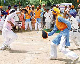 Youths display gatka skills at Khalsai Khedan that began at Talwandi Sabo on Sunday. 