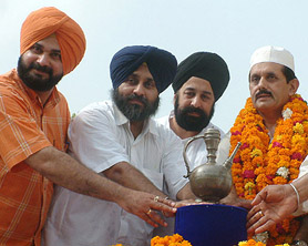 Navjot Sidhu, Sukhbir Badal and Rai Aziz Ulah Khan (extreme right) with ‘Ganga Sagar’ of Guru Gobind Singh at the Wagah joint check post on Sunday.