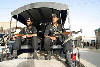 Pakistani soldiers patrol a street after the killing of Balouch nationalist leader Nawab Akbar Khan Bugti in Quetta on Sunday.
