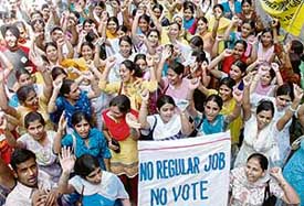 Members of the Computer Teachers Union (contractual), Punjab, protest in front of the office of the Sarv Sikhia Abhian, Punjab, Sector 34, Chandigarh, on Monday.