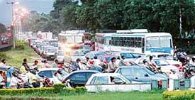 Traffic jam caused by a protest by the Computer Teachers Union (Contractual), Punjab, at the road dividing Sectors 34 and 20 in Chandigarh on Monday. 