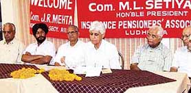 Mr M.L. Sharma (centre) at the LIC pensioners meeting in Ludhiana on Sunday.