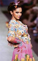 A model displays creation by Manish Arora on the opening day of the Wills Lifestyle Fashion Week in New Delhi on Wednesday. India Fashion Week will run up to September 3, showcasing designs from 75 Indian designers.