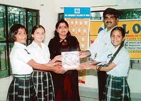 Students of Rayat International School, Rail Majra, near Ropar pose with an appreciation certificate received from the SOS Villages of India, a childcare organisation