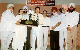 PU Vice-Chancellor R. C. Sobti being honoured by Ms Roop Brar, president, GNN college, Doraha, on the occasion of the birth anniversary of Dr Ishwar Singh, founder president of the college