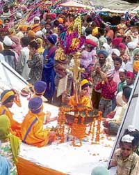Devotees at a religious procession to mark the 520th marriage anniversary of Guru Nanak in Batala