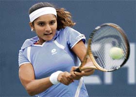 Sania Mirza plays a return to Italys Francesca Schiavone during their second-round match at the US Open in New York