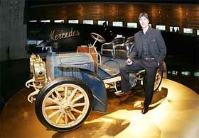 German national soccer team coach Joachim Loew poses with 1902 Mercedes Simplex during his team's visit to the Mercedes Benz Museum in Stuttgart on Friday.