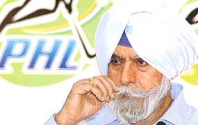 President of The Indian Hockey Federation, K. P. S. Gill addresses the media during a press conference in New Delhi on Friday.