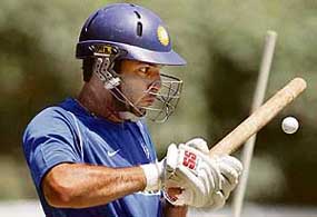 Yuvraj Singh eyes a golf ball during a practice session at the National Cricket Academy in Bangalore  on Friday.