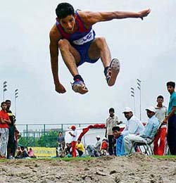 A long jump event in progress during the 21st Haryana State Junior Athletics Championship at Tau Devi Lal Sports Complex, Sector 3, Panchkula