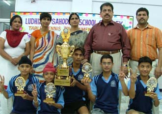 Students at Green Land Senior Secondary School, who won titles in the Ludhiana Sahodya Schools Complex Table Tennis Tournament are seen with Mr Rajesh Rudra and Ms Bladeep Pandher, Chairman and Principal of the school, respectively, in Ludhiana on Saturday.