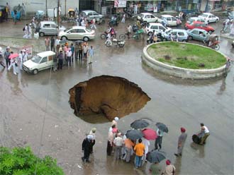 A crater that was formed in the Model Town area near BCM School In Ludhiana after a part of road caved in on Saturday.