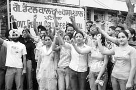 BDS students hold a protest outside the main gate of Government Dental College and Hospital in Patiala on Saturday. 