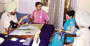 Mr Darshan Singh, SHO, Sadar, Ahmedgarh, questions Parwinder Kaur on Monday.