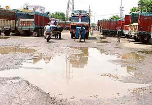 Bad roads in Transport Nagar need immediate attention.