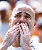 Andre Agassi of the US blows a kiss to the crowd after his loss against Germanys Benjamin Becker at the US Open in New York on Sunday