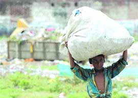 For a ragpicker child day’s job has to be done to ward off hunger.
