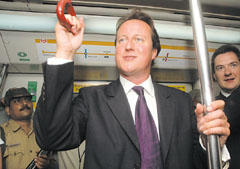 The UK Leader of the Opposition, Mr David Cameron, taking a ride on the Delhi Metro