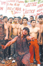 Wrestlers and body builders protesting against the sealing of gyms and health centres in residential areas at Jantar Mantar in the Capital 