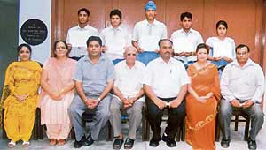 Students of Sanatan Vidya Mandir Senior Secondary School, Civil Lines, with members of the school management committee after being honoured in Ludhiana on Wednesday.
