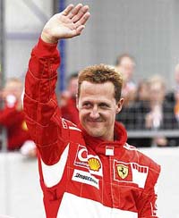 Ferrari F1 driver Michael Schumacher of Germany waves to fans at the end of three days of the Ferrari Racing Days at the Nuerburgring racing circuit in western Germany on September 3.