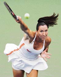 Serbias Jelena Jankovic serves to Russias Elena Dementieva during their quarterfinal match at the US Open in New York on Tuesday. Jankovic won 6-2, 6-1.