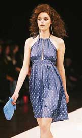 A model displays an outfit by Australian label White Suede at the Melbourne Spring Fashion Week in Melbourne on Thursday.