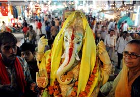 An idol of Lord Ganesh being taken out in a procession to be immersed in the Sutlej in Ludhiana on the occasion of Ganesh Chaturthi on Wednesday evening