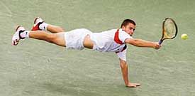 Russias Mikhail Youzhny at full stretch against Spains Rafael Nadal during the quarterfinal of the US Open tennis tournament in New York on Wednesday