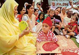 Tiny tots of Evergreen Academy celebrate Grandparents Day with inmates of Old Age Home, Sector 15, Chandigarh.