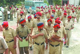 Punjab Police constables of Jalandhar district coming out a centre after appearing for written test for their promotion at Desh Bhagat Yadgar Hall in Jalandhar