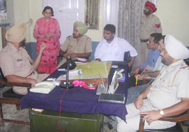 The DSP of Malerkotla, Mr Rachhpal Singh Hara, interrogates Dr Parwinder Kaur at Ahmedgarh police station
