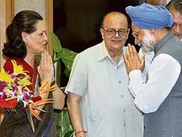 Congress president Sonia Gandhi greets Prime Minister Manmohan Singh before his departure to Brazil and Cuba for the India-Brazil- South Africa Summit