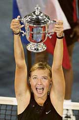 Russias Maria Sharapova holds the womens US Open trophy in New York on Saturday