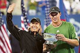 Martina Navratilova of the US and compatriot Bob Bryan hold the trophy after defeating Czech Republics Kveta Peschke and Martin Damm to win the mixed doubles final of the US Open in New York on Saturday
