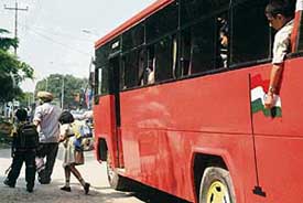 In violation of rules, buses, not even painted yellow, continue to ferry school students in Chandigarh