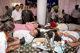 Volunteers donate blood at the 60th foundation day celebrations of Oriental Insurance Company in Sector 17, Chandigarh, on Tuesday