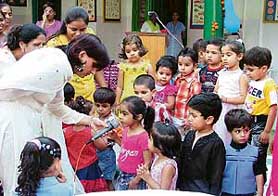 Tiny-tots of Hollyhock Nursery School answering questions about their grandparents during Grandparent Day in school in Ludhiana on Monday. 