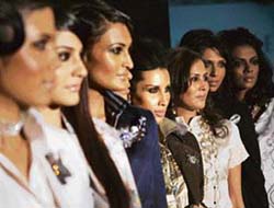 Models pose as they present outfits by Van Heusen