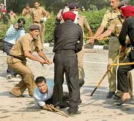 Protesting unemployed youths from Punjab face water cannon and lathi charge at Matka Chowk in Chandigarh on Thursday. 