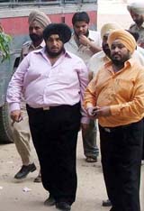 Liquor contractor Charanjit Bajaj arrested by the police in Ludhiana on Thursday