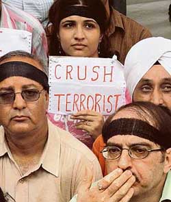 Kashmiri Pandits sit in dharna under the banner of Kashmiri Samiti to observe Balidan Divas at Jantar Mantar in New Delhi on Thursday