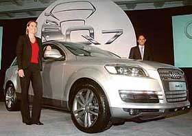 Mr Andre Konsbruck (right), Executive Director, Overseas Region, Audi, and Ms Sandra Berger, Product Manager, pose with Audi's SUV Q7, which was launched in New Delhi on Friday. The SUV will be available in two variants, a 4.2- litre V8 engine and a 3.0 TDI six-cylinder engine and is priced at Rs 61 lakh (ex-showroom Delhi). Mr Konsbruck said Audi was exploring options for assembling cars in India. The company hopes to sell 300 units of Q7 this year and 600 units in 2007.