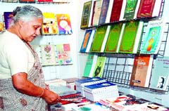 Delhi Chief Minister Sheila Dikshit at a stall after inaugurating the 12th Delhi Book Fair at Pragati Maidan in the Capital 