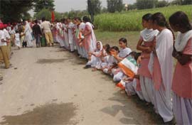 Students of Government Senior Secondary School, Lakhan Ke Padde, Kapurthala, waiting for Capt Amarinder Singh on Saturday.